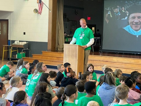 Principal Lynch speaks at a P2 assembly