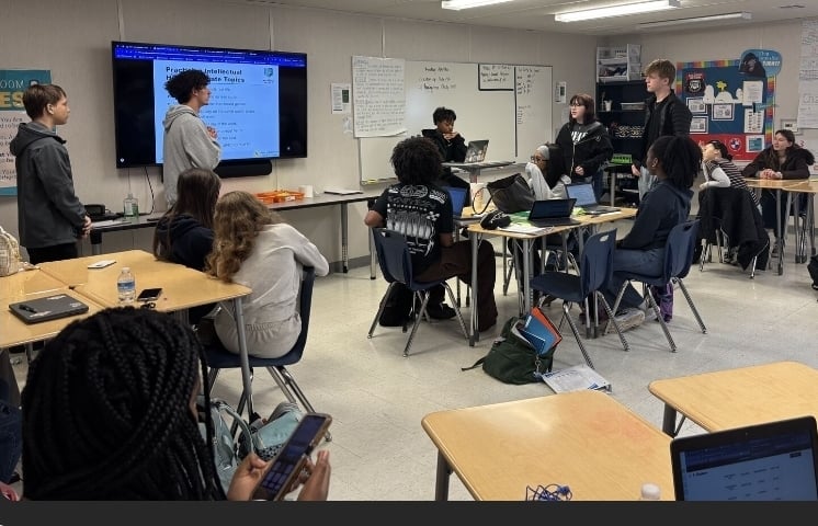 student-leading-discussion