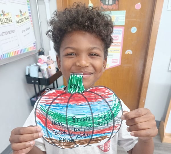 kid makes a positivity pumpkin at st jeromes catholic school