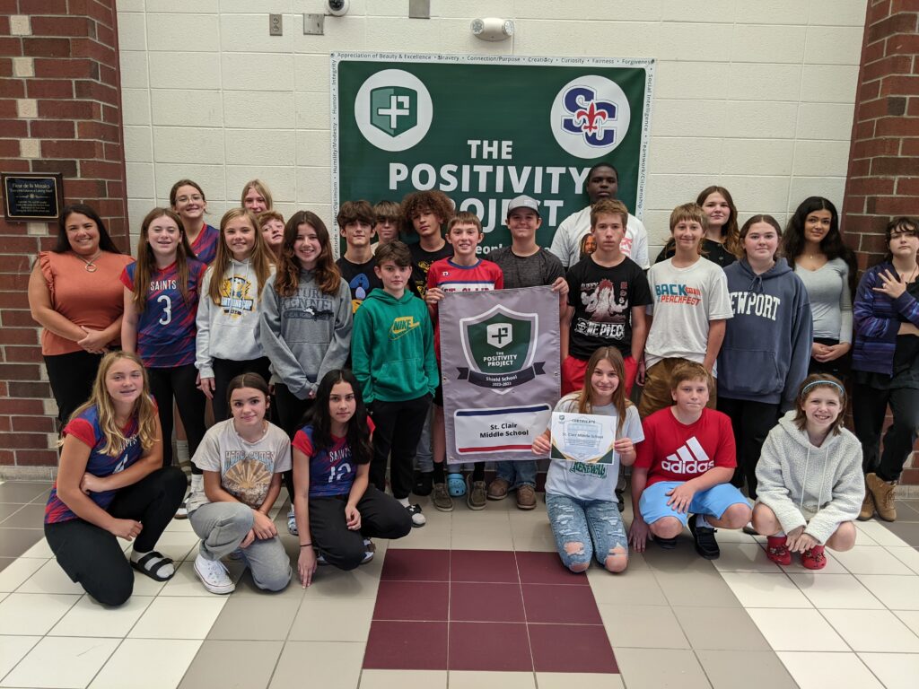 Students posing with the P2 Green Shield