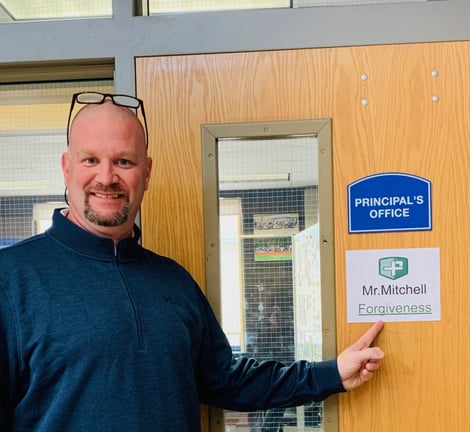 Principal Michael (Mike) Mitchell of Cairo-Durham middle school points to his top Positivity Project character strength: forgiveness.