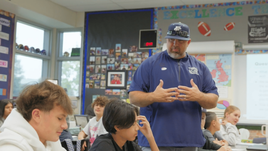 A teacher addressing his students