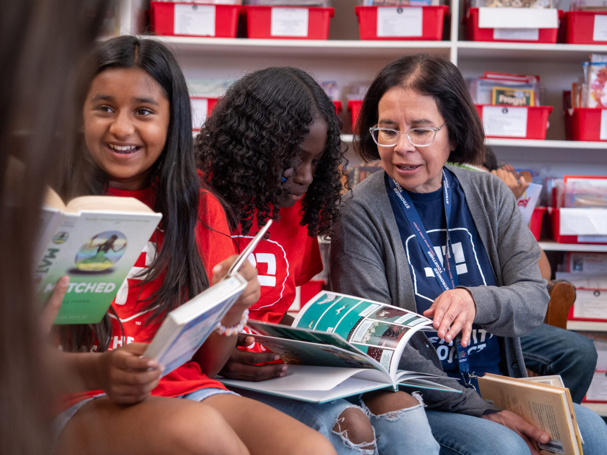 lone star elementary teacher in library with students
