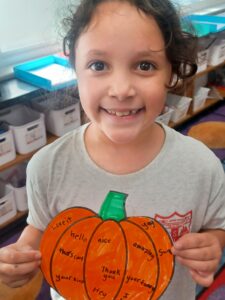 st jeromes catholic school student with positivity pumpkin