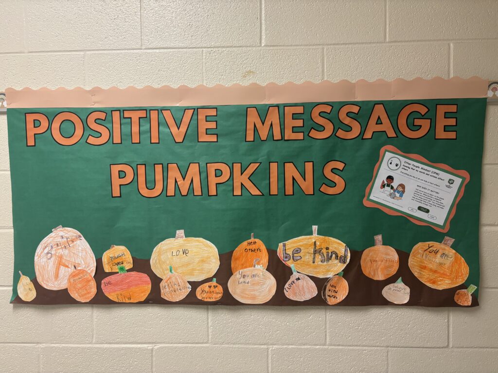 positive message pumpkins on bulletin board