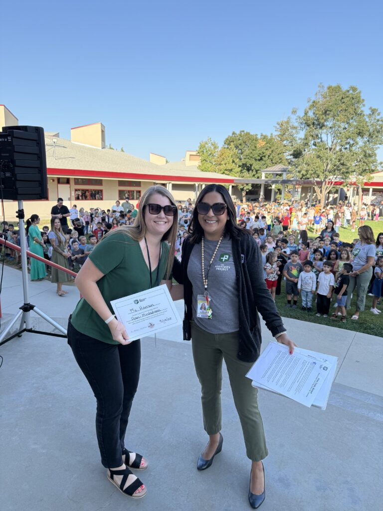 Principal Eva Martinez with students