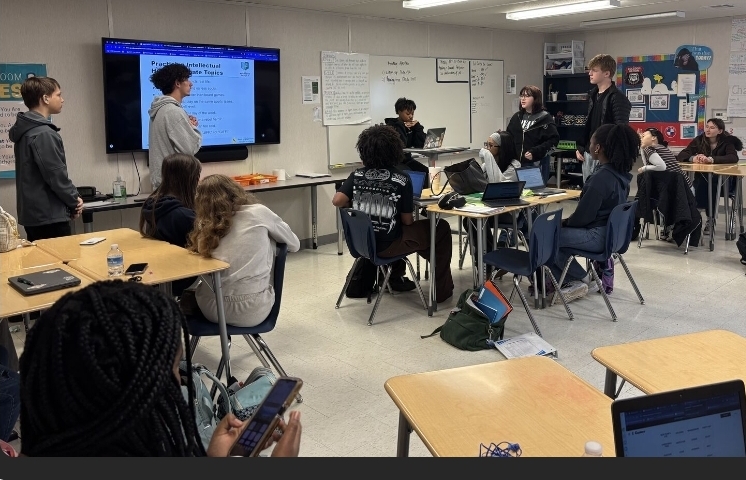student-leading-discussion