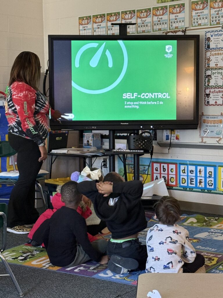 students-on-floor-in-classroom-setting