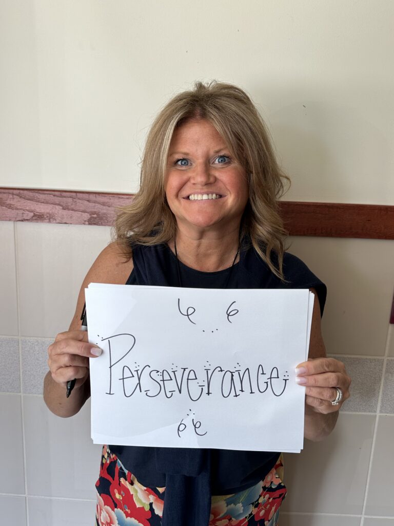 middle-aged-blonde-woman-holding-sign