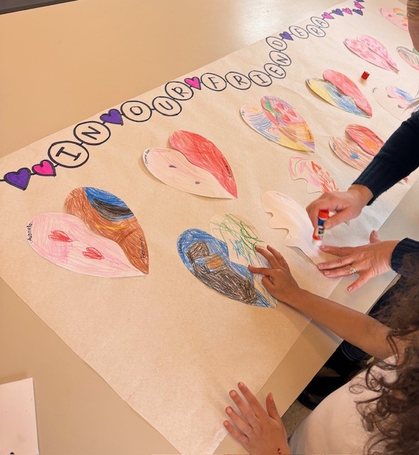 overhead-shot-of-elementary-students-coloring-in-hearts
