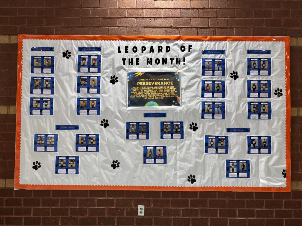white-banner-highlighting-students-of-the-month-in-school-hallway