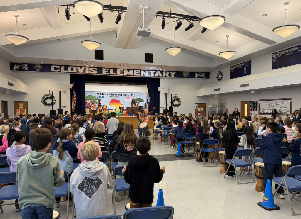students-in-multipurpose-room-taking-interactive-drum-lesson